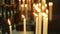 Background candles burning in the Church