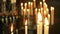Background candles burning in the church