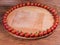 Background of cherry tomatoes on perimeter of wooden serving board