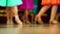 Background - children`s tournament on ballroom dances - feet on the floor