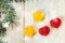 Background from christmas tree and yellow and red jujube.White wooden table