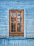 Background of city buildings from vintage wood. Nice window. The old town of Gatchina. Russia.