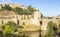 Background cityscape view of the ramparts Toledo Alcantara bridge