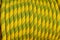 Background with climbing rope yellow, orange, yellow and green a rope for climbing sport. Background for mountain sports