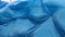 Background of closeup of blue plastic sheet on the wind