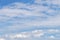 Background cloudscape with cumulus and cirrostratus clouds