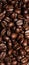 Background of coffee beans, vertical image