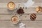 Background of coffee, cappuccino, sugar, milk, cookies on the table.