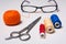 Background of coil multicolored thread, glasses and scissors