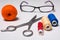 Background of coil multicolored thread, glasses and scissors