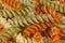 Background of colored spiral pasta , close-up