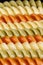 Background of colored spiral pasta , pattern