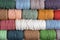 Background of colorful macrame yarns. Texture of natural cotton macrame yarn rolls. Flat lay