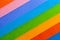 Background of colorful paper parallel diagonal stripes.