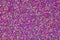 Background of colorful purple sprinkles. Food texture and pattern.