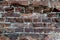 Background of a concave wall of old red brick