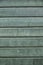 Background consisting of weathered green grey boards