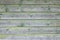 Background consisting of weathered green grey boards