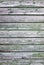 Background consisting of weathered green grey boards