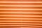 The background consists of horizontal stripes of orange and yellow with an abstract pattern. Design backgrounds textures