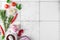 The background of cooking on white rustic tile background. Top view with copy space. Spices, herbs and vegetables
