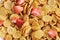 Background of corn flakes with slices of strawberries