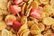 Background of corn flakes with slices of strawberries