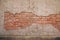 Background of crack color and cement concrete surface of antique abandoned house. can see texture of old red brick wall in side