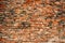 Background of cracked warehouse brick wall texture.
