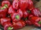 Background cut red sweet pepper in basket bulgarian pepper fresh, assorted colorful capsicum paprika on a counter in the