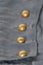 Background, dark blue fabric with brass buttons, cages, texture