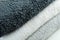 Background of the detail of a terrycloth towels in different shades of gray and white