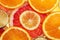 Background of different colored slices of citrus fruits ,close u