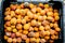 A background of discarded rotten fruits left to waste after the market. Apricots