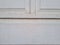 The background of the door of the house with white paint combined with black shadowed lines
