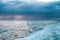 Background of dramatic sunrise on the sailing boat with tranquil sea water and epic morning sky, romantic Britanny coastline,