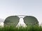 Background about dreams with sunglasses, grass and sky