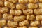 Background of extruded peanut flips from above.