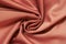 Background of fabric of twisted in spiral. Textile texture