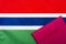 On the background of the flag of the Gambia is a passport