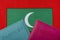 On the background of the flag of Maldives two passports