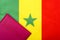 On the background of the flag of Senegal is a passport