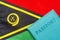 On the background of the flag of Vanuatu is a passport