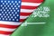 Background of the flags of saudi arabia and USA. The concept of interaction or counteraction between the two countries