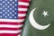 Background of the flags of the USA and pakistan. The concept of interaction or counteraction between two countries. International