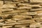 Background of flat bright stones piled cobbles closeup