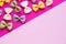 Background flat lay and farfalle. Pink flat lay and colorful farfalle. Place for text. Farfalle, flat lay, pink