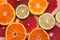 Background flat lay halves of citrus, orange, lime and grapefruit. View from above