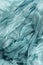 Background folds of sparse margilan turquoise color hand-colored silk