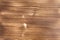 Background in the form of a wooden surface, lightly treated with a fire of light brown color with horizontal textural stripes on